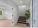 Modern staircase with dark metal railings and light hardwood floors at 3109 Colyer Pl, Charlotte, NC 28205