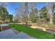 Expansive backyard with mature trees and grassy lawn at 3109 Colyer Pl, Charlotte, NC 28205