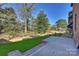 Private backyard patio with spacious grassy area at 3109 Colyer Pl, Charlotte, NC 28205