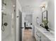 Elegant bathroom with double vanity, walk-in shower, and bedroom view at 3109 Colyer Pl, Charlotte, NC 28205