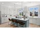 Modern kitchen with white cabinets and a blue island at 3109 Colyer Pl, Charlotte, NC 28205