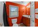 Bright bathroom with orange walls and a shower/tub combo at 902 Oval St, Kannapolis, NC 28081