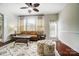 Living room features a comfortable couch, ottoman and hardwood floors at 8928 Carneros Creek Rd, Charlotte, NC 28214