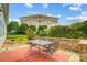 Outdoor patio with table, chairs, and umbrella at 8928 Carneros Creek Rd, Charlotte, NC 28214