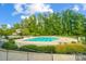 Community lap pool and leisure pool with slide at 8928 Carneros Creek Rd, Charlotte, NC 28214
