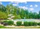 Community pool with waterslide and lush landscaping at 8928 Carneros Creek Rd, Charlotte, NC 28214