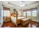 Spacious bedroom with hardwood floors and a four-poster bed at 8928 Carneros Creek Rd, Charlotte, NC 28214