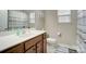Clean bathroom with a shower/tub combo and wood vanity at 8928 Carneros Creek Rd, Charlotte, NC 28214