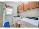 Laundry room with washer, dryer, and upper cabinets at 8928 Carneros Creek Rd, Charlotte, NC 28214