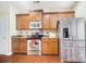 Modern kitchen features stainless steel appliances and ample wood cabinets at 8928 Carneros Creek Rd, Charlotte, NC 28214