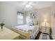 Bedroom with light-colored furnishings and hardwood floors at 8928 Carneros Creek Rd, Charlotte, NC 28214