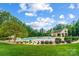 Community pool area with clubhouse and landscaping at 8928 Carneros Creek Rd, Charlotte, NC 28214
