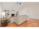 Living room with hardwood floors, fireplace, and access to patio at 9101 New Oak Ln, Huntersville, NC 28078