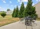 Private backyard patio with metal table and chairs, perfect for outdoor dining at 4169 Oconnell St, Indian Trail, NC 28079