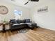 Bedroom with gray sectional sofa, wood-look floors, and a window at 4169 Oconnell St, Indian Trail, NC 28079