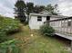 View of the house exterior, deck and yard at 6124 Old Mt Holly Rd, Charlotte, NC 28208