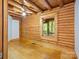 Bedroom with wood walls, wood floors and a window at 5082 Mount Carmel Rd, Heath Springs, SC 29058