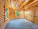 Bedroom with wood walls and carpet at 5082 Mount Carmel Rd, Heath Springs, SC 29058