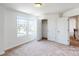 Well-lit bedroom featuring carpet and double door closets at 8597 Acadia Pkwy, Sherrills Ford, NC 28673