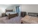 Bedroom with two beds and ample closet space at 13050 Regent Grove Ln, Huntersville, NC 28078