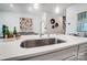 Modern kitchen island with quartz countertop and stainless steel sink at 2215 Hedgecliff Rd # 2, Kannapolis, NC 28083