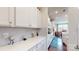 Modern kitchen with white cabinets, stainless steel appliances, and an island at 775 Kathy Dianne Dr, Fort Mill, SC 29707