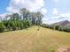 Large backyard with fenced-in pool and manicured lawn at 775 Kathy Dianne Dr, Fort Mill, SC 29707