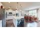 Modern kitchen with white cabinets, island, and breakfast nook at 775 Kathy Dianne Dr, Fort Mill, SC 29707