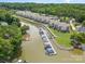 Aerial view of waterfront community with boat slips and lush landscaping at 104 Pier 33 Dr # 312, Mooresville, NC 28117