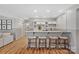 Basement bar with a sleek countertop and comfortable seating at 19424 Bankhead Rd, Charlotte, NC 28278