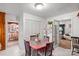 Kitchen with table and view into dining room at 1736 Woodland Dr, Charlotte, NC 28205