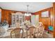 Formal dining room with wood paneling and buffet at 1736 Woodland Dr, Charlotte, NC 28205