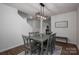 Dining room with gray table and chairs, hardwood floors, and a view of the living room at 1778 Bright Hope Ln, Dallas, NC 28034