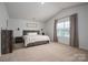 Spacious bedroom with large window and plush carpeting at 1778 Bright Hope Ln, Dallas, NC 28034