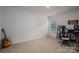 Bright bedroom with a guitar, desk, and chair at 1778 Bright Hope Ln, Dallas, NC 28034