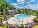 Resort-style community pool with water features, lounge chairs, and umbrellas at 775 Kathy Dianne Dr, Fort Mill, SC 29707