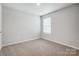 Empty bedroom with neutral walls and carpet at 2235 Hedgecliff Rd # 4, Kannapolis, NC 28025