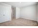 Simple bedroom with neutral walls and carpeting at 2235 Hedgecliff Rd # 4, Kannapolis, NC 28025