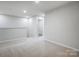 Bright hallway with carpeted floors and access to bedrooms and bathroom at 2235 Hedgecliff Rd # 4, Kannapolis, NC 28025