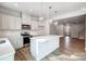 Open concept kitchen with island and adjacent living space at 2235 Hedgecliff Rd # 4, Kannapolis, NC 28025