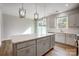 Island kitchen with white cabinets and stainless steel appliances at 2235 Hedgecliff Rd # 4, Kannapolis, NC 28025