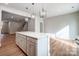 Open kitchen with white cabinets and large kitchen island at 2235 Hedgecliff Rd # 4, Kannapolis, NC 28025
