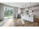 Modern kitchen featuring a large island, stainless steel appliances, and hardwood floors at 2235 Hedgecliff Rd # 4, Kannapolis, NC 28025