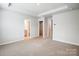 Main bedroom with carpet, double closets, and en-suite bathroom access at 2235 Hedgecliff Rd # 4, Kannapolis, NC 28025