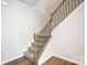 Elegant staircase with wood and metal railing leading to the upper level at 2235 Hedgecliff Rd # 4, Kannapolis, NC 28025