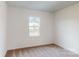 Cozy carpeted bedroom with a window at 233 Winford Rd, Troutman, NC 28116