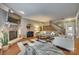 Open living room showcasing a stone fireplace and staircase at 1909 Madeira Cir, Waxhaw, NC 28173