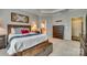 Main bedroom with large bed, dresser, and en-suite bath at 1909 Madeira Cir, Waxhaw, NC 28173