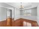 Bright dining room with hardwood floors and view of bathroom at 141 Planters Dr, Statesville, NC 28677