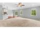 Spacious living room featuring hardwood floors and a ceiling fan at 141 Planters Dr, Statesville, NC 28677